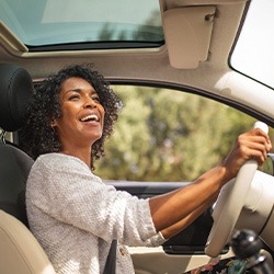 Woman smiling while driving