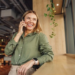 Woman smiling while talking on cellphone