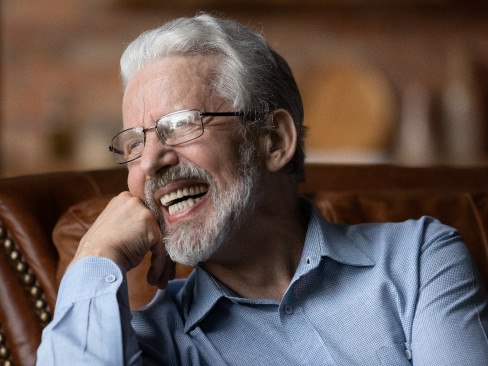 Man with dentures laughing