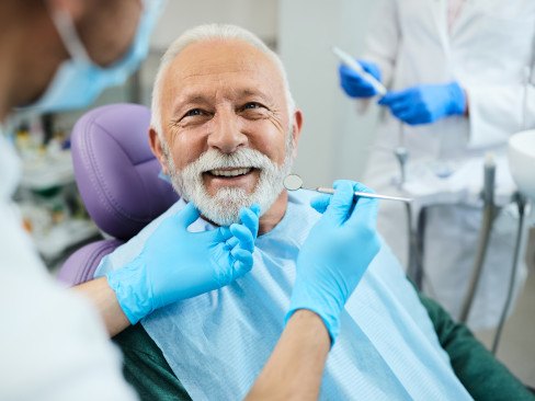 Man smiling at the dentist