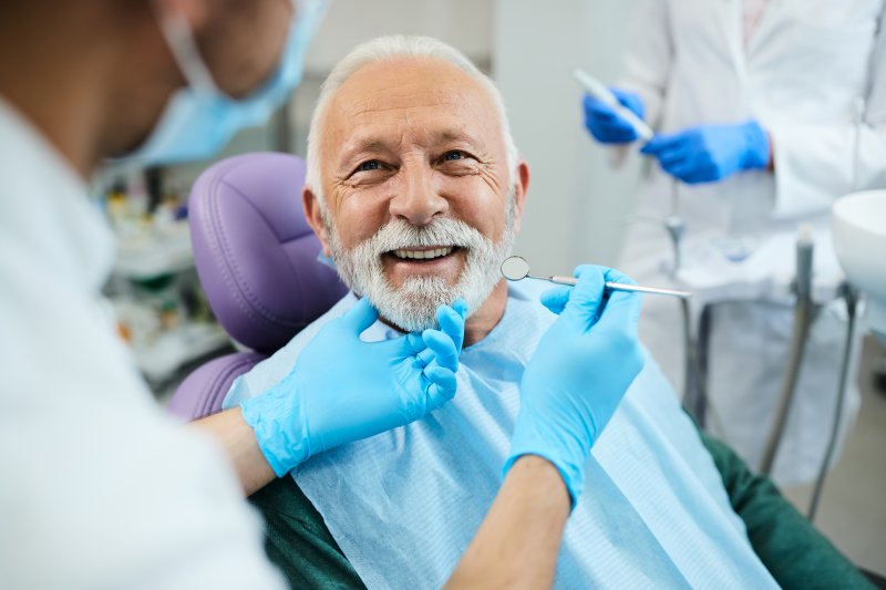 Man with dentures at the dentist