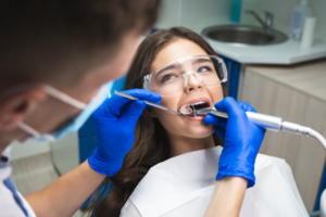 Dentist examining a patient’s teeth